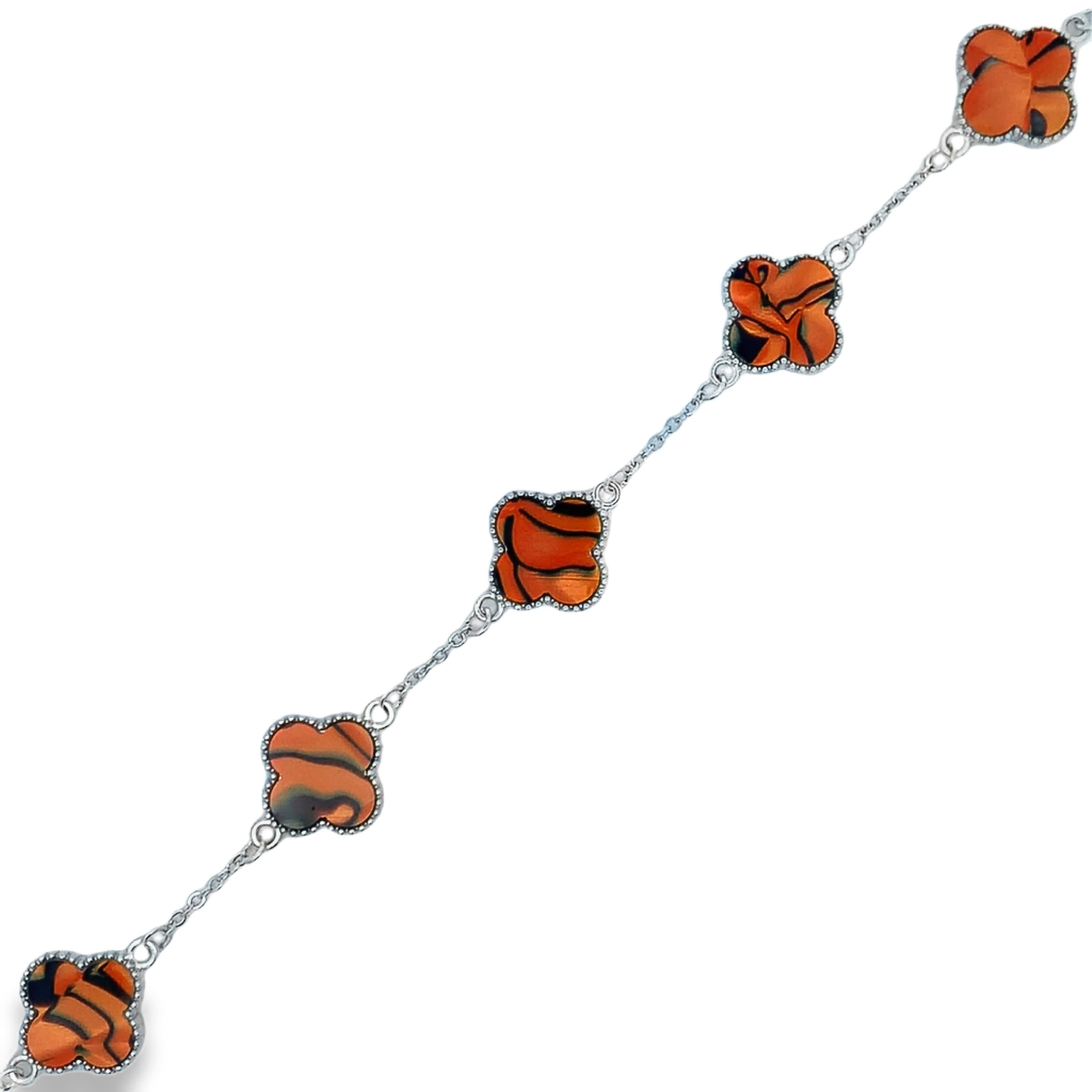 Bransoletka łańcuszkowa w białym metalicznym wykończeniu z kaboszonem z żółto-pomarańczowego kamienia w kształcie gwiazdy