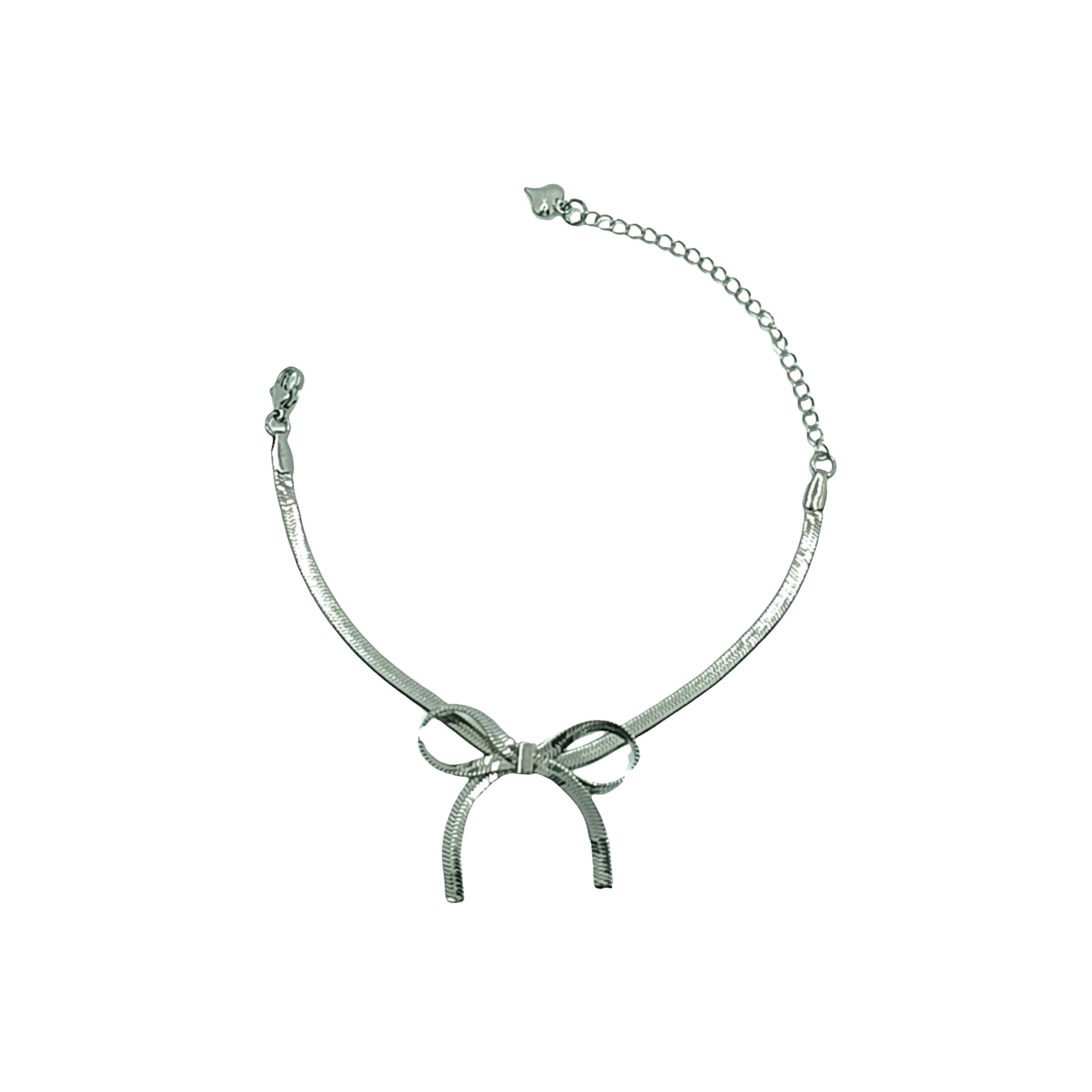 Elegancka posrebrzana bransoletka z kokardą