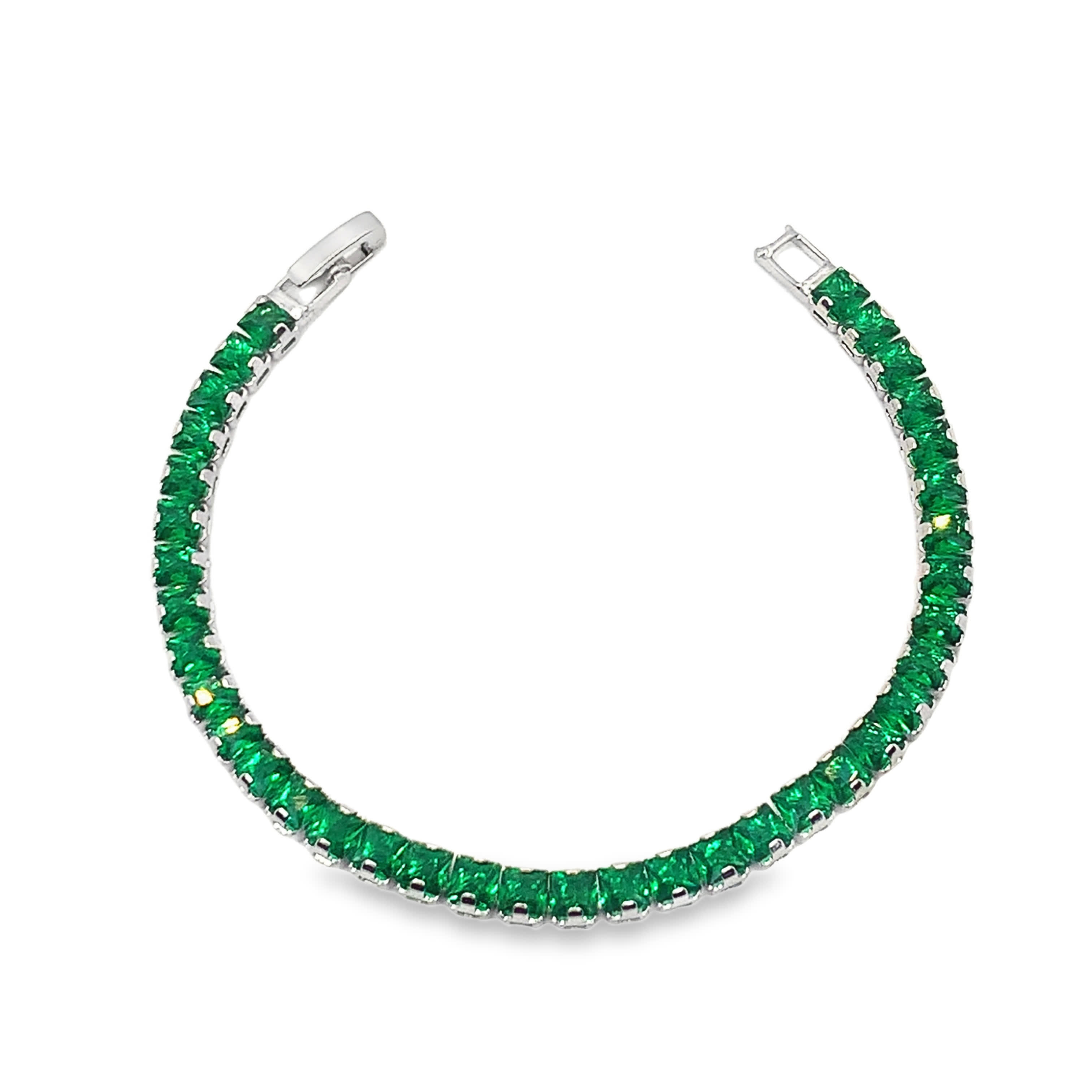 Bransoletka tenisowa z białego złota ozdobiona szmaragdami o szlifie schodkowym