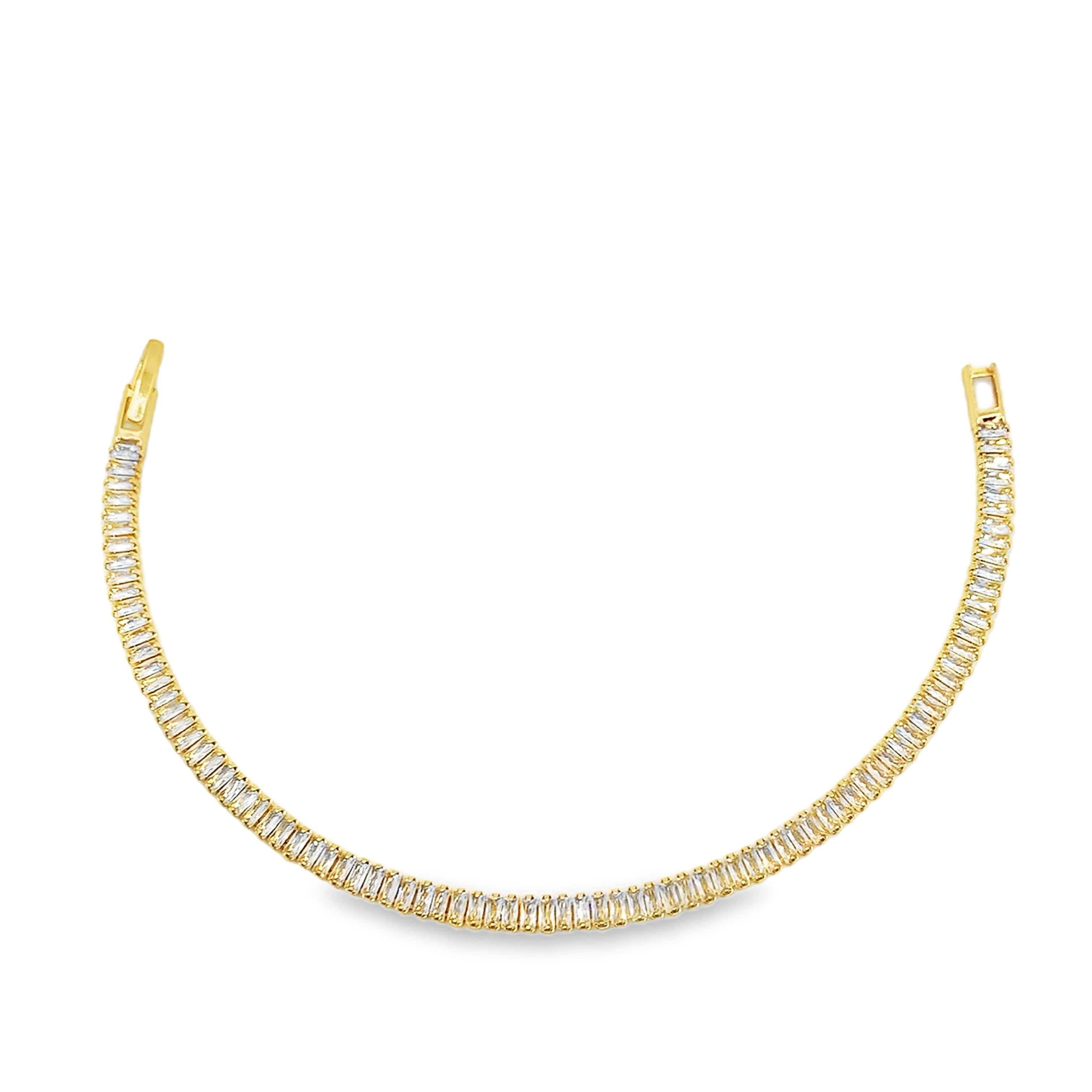 Bransoletka tenisowa ze złoconej stali z kamieniami o szlifie bagietkowym