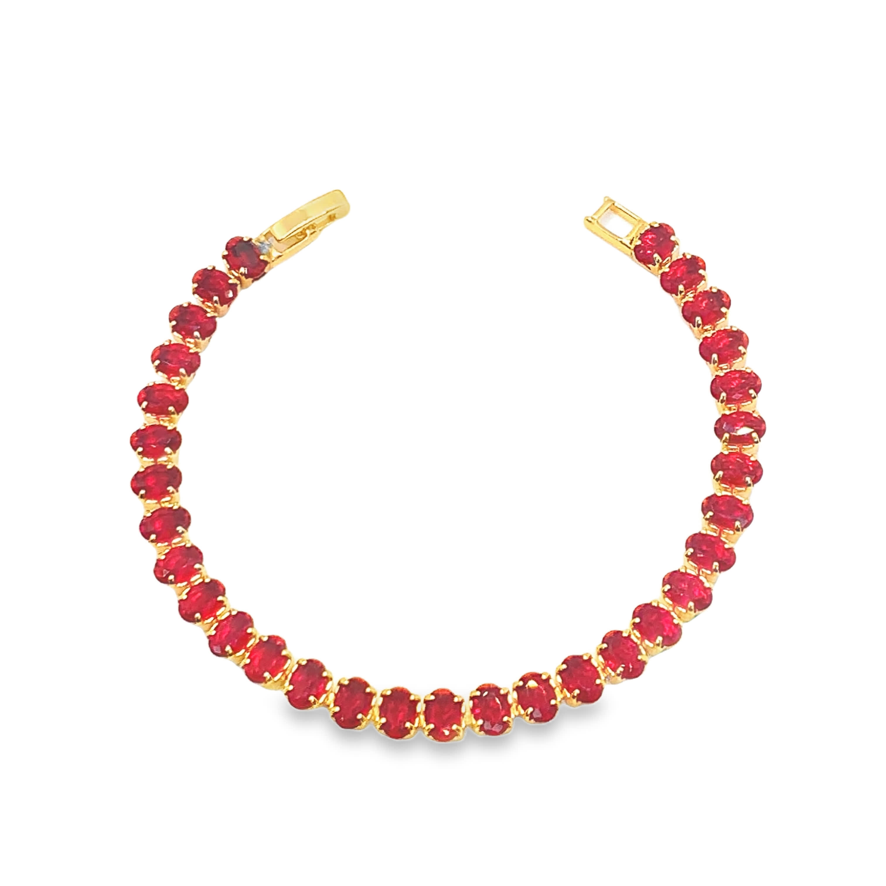 Bransoletka tenisowa w kolorze żółtego złota z owalnymi kaboszonami rubinowymi