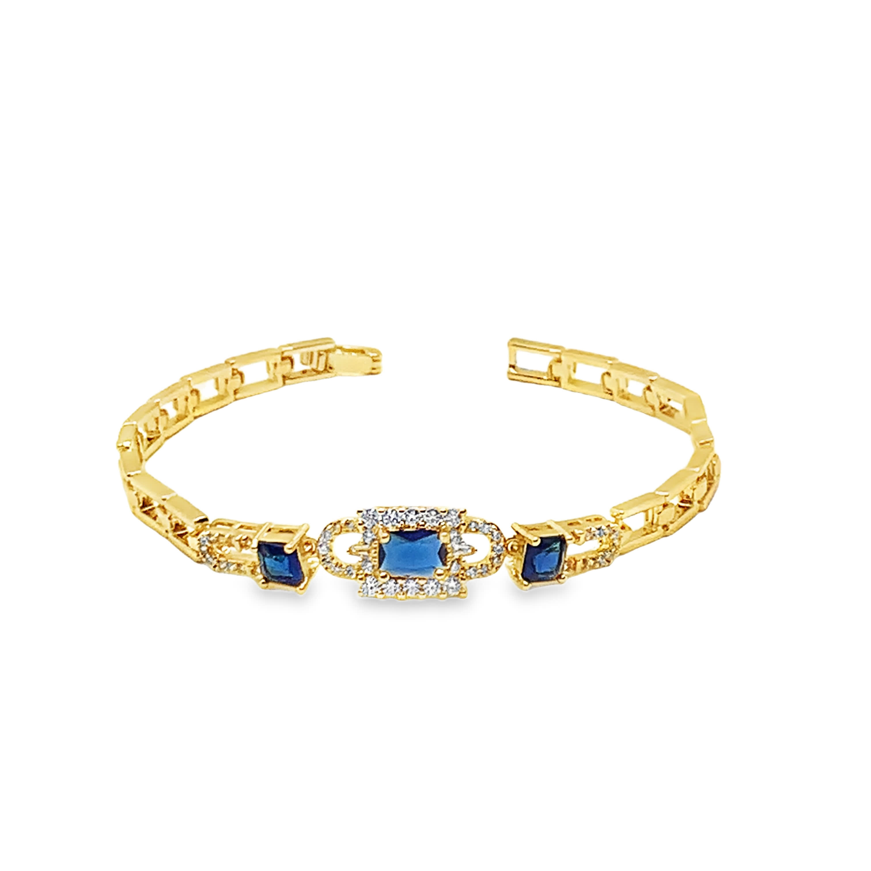 Bransoletka w kolorze żółtego złota z łańcuszkiem i głębokim niebieskim szafirem