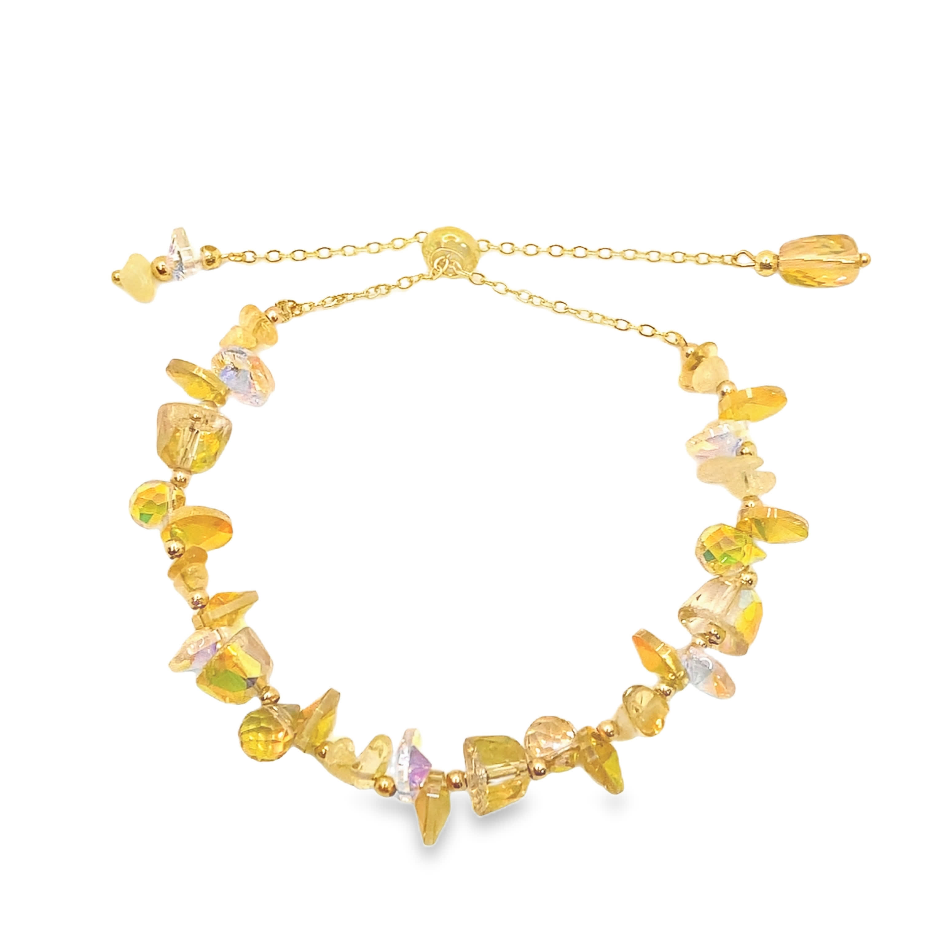 Bransoletka w kolorze żółtego złota z łańcuszkami i błyszczącymi kryształowymi kaboszonami