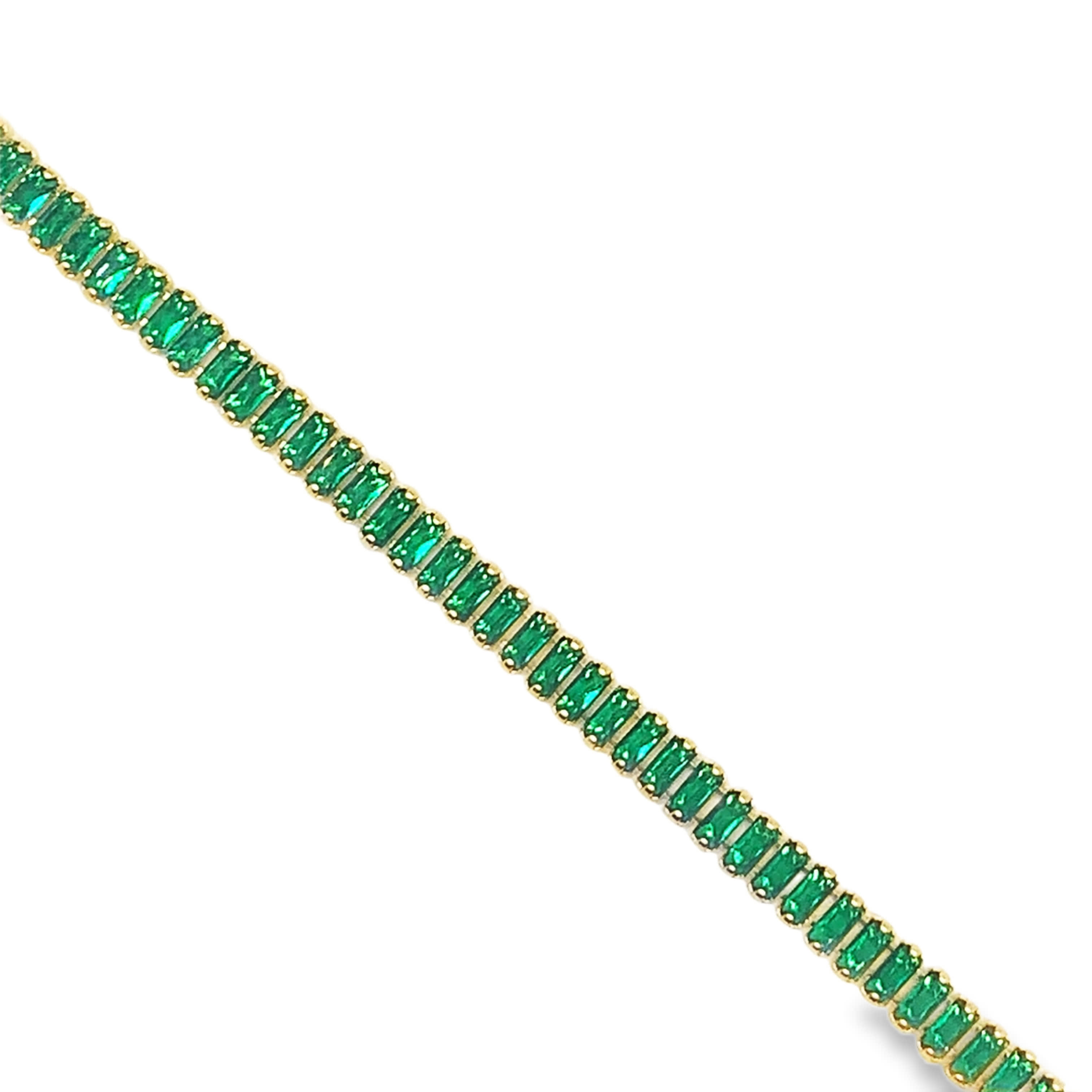 Bransoletka tenisowa w kolorze żółtego złota ze szmaragdem