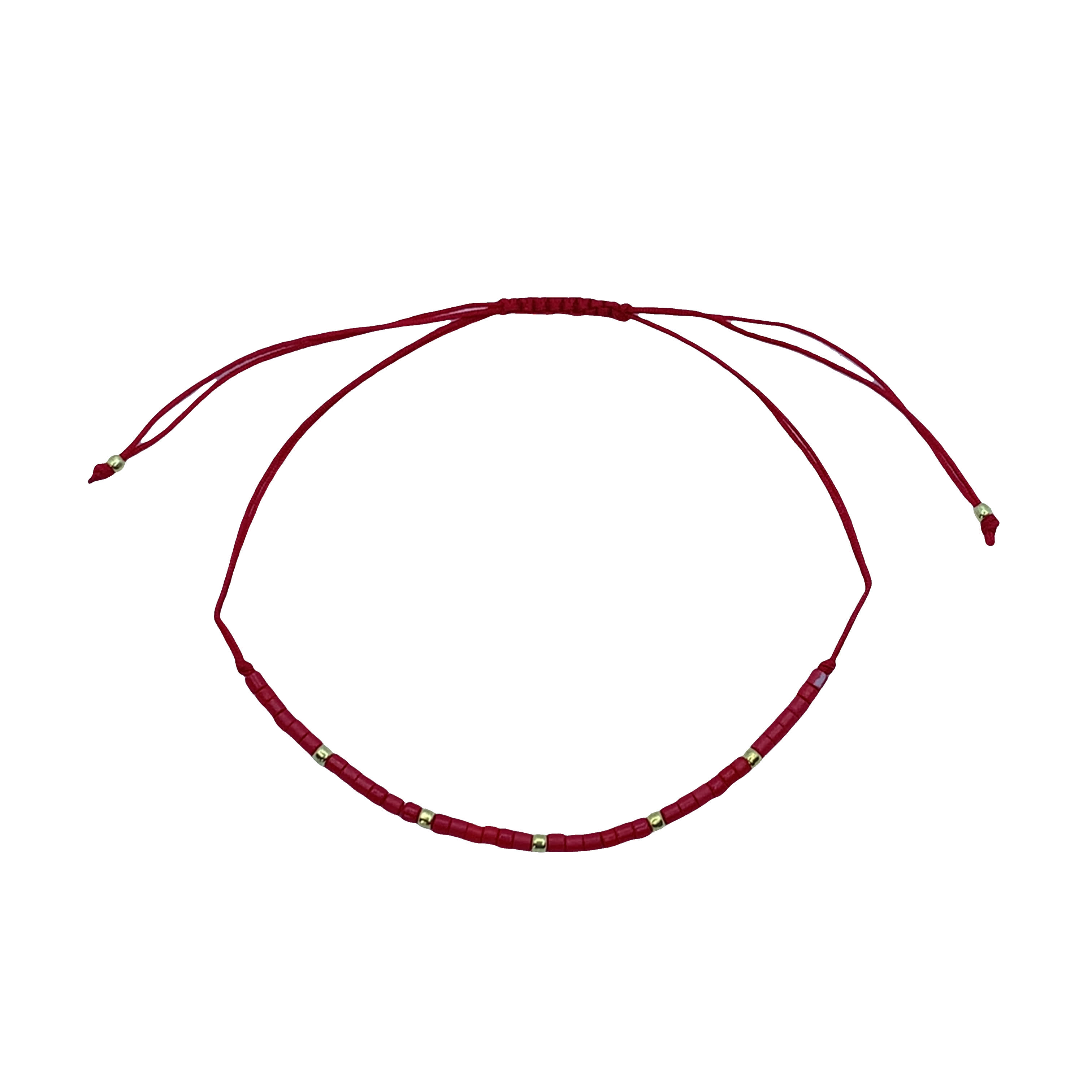 Czerwona bransoletka z koralikami i złocistymi akcentami