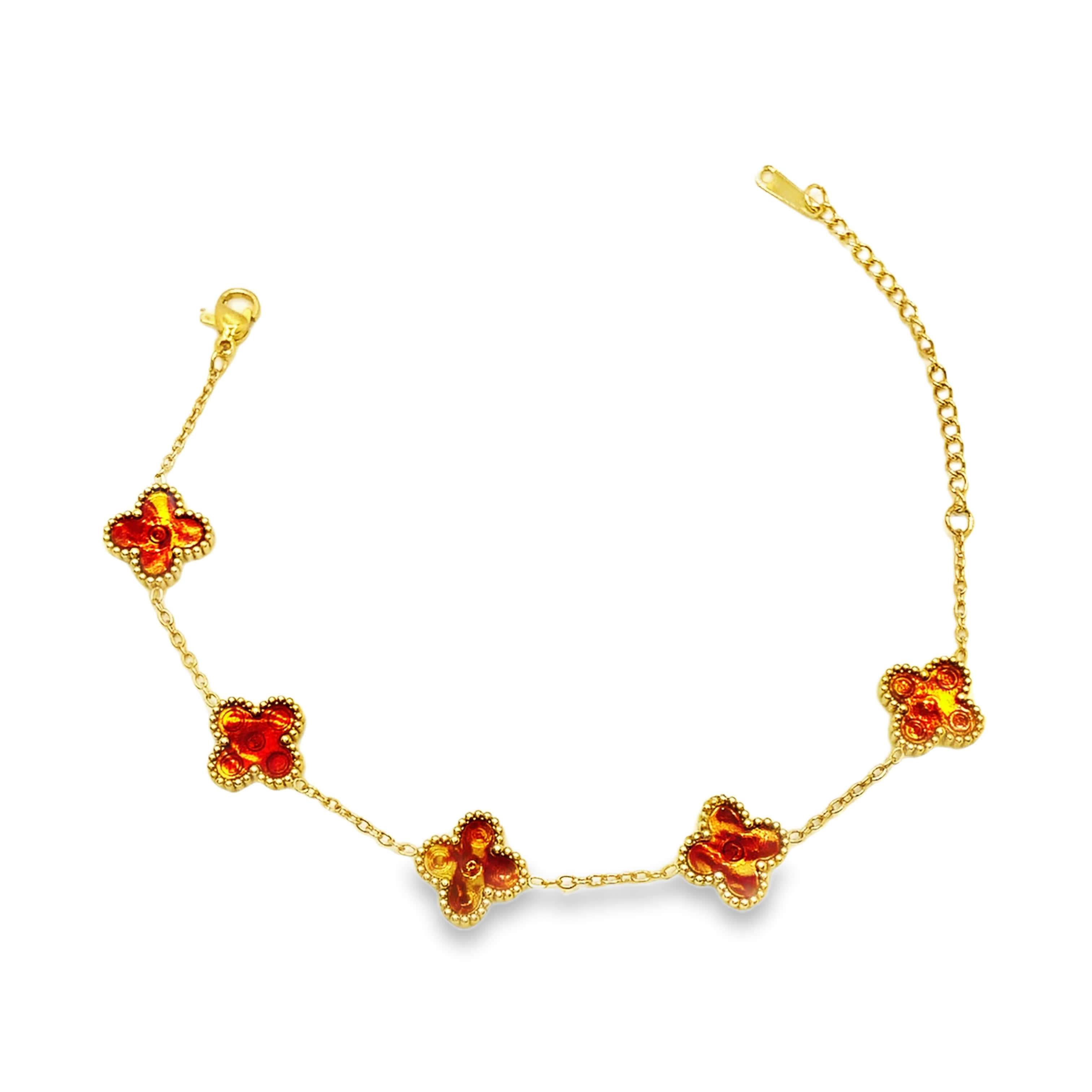 Delikatna bransoletka w kolorze żółtego złota z zawieszkami w kształcie czwórliści