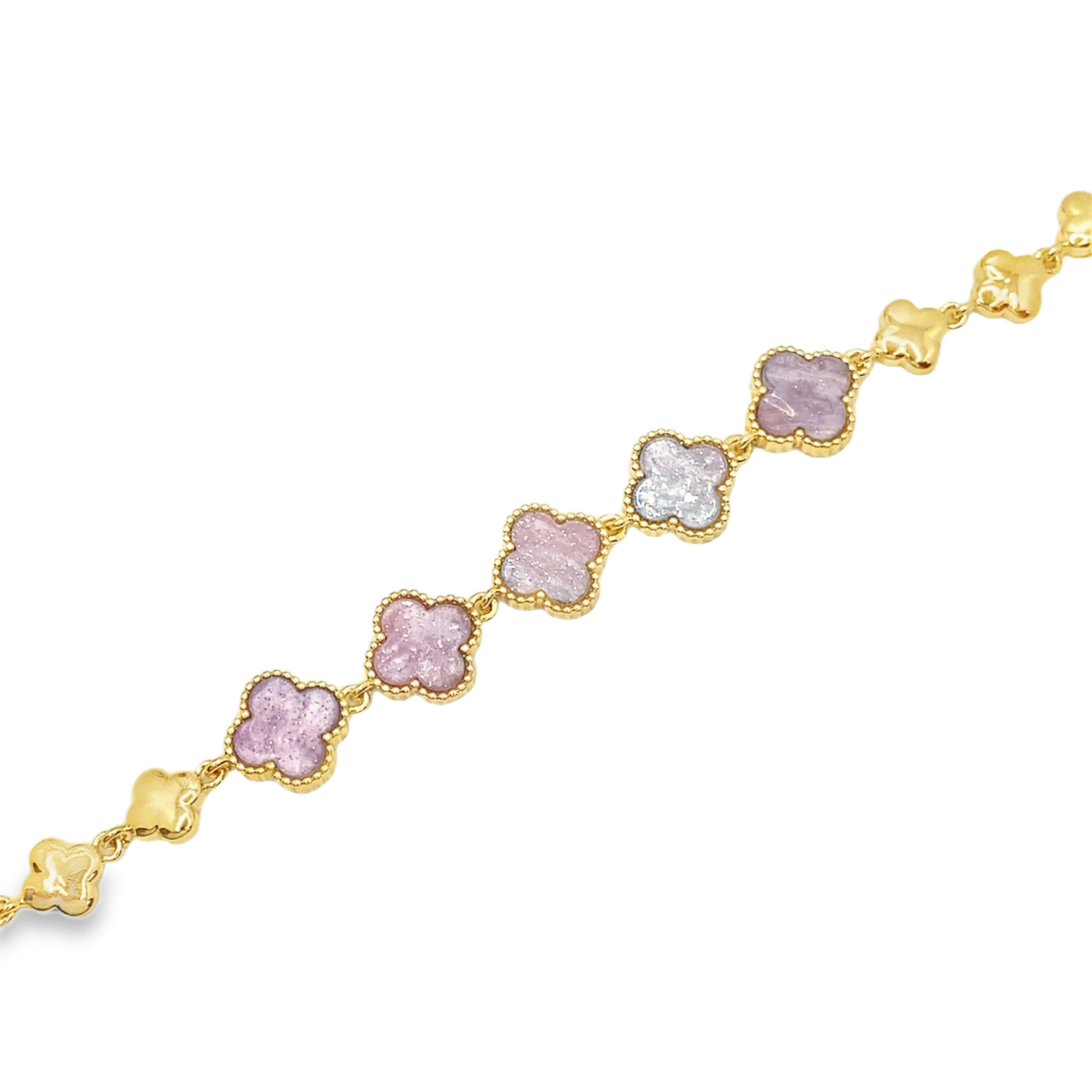 Bransoletka w kolorze żółtego złota z łańcuszkiem i fioletowymi akcentami kwarcu