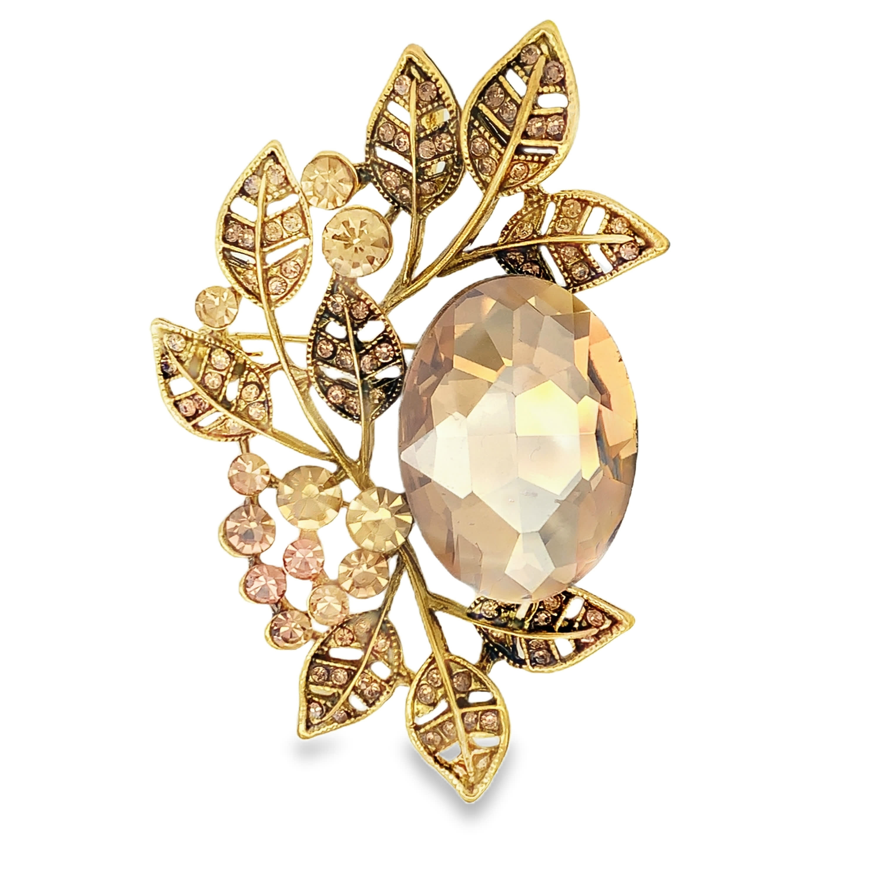 Pozłacana ażurowa broszka liść z owalnym kamieniem w odcieniu szampańskim
